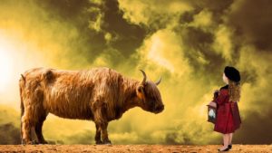 Aszendent Stier begegnet der Welt friedlich, gemütlich und ruhig, so wie der Stier gelassen auf das kleine Mädchen reagiert
